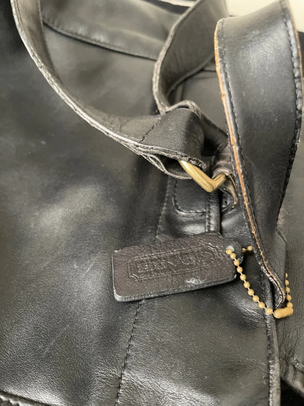 Coach Black Leather Drawstring Backpack with Front Zip Pocket